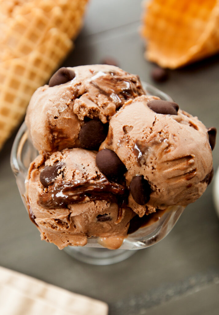 Overhead view of three scoops of triple chocolate ice cream.