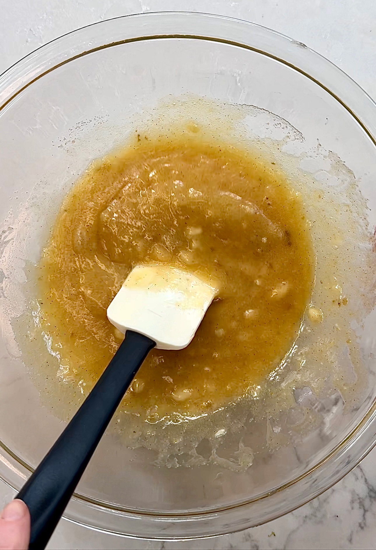fully mixed wet ingredients for banana peanut butter cookies.